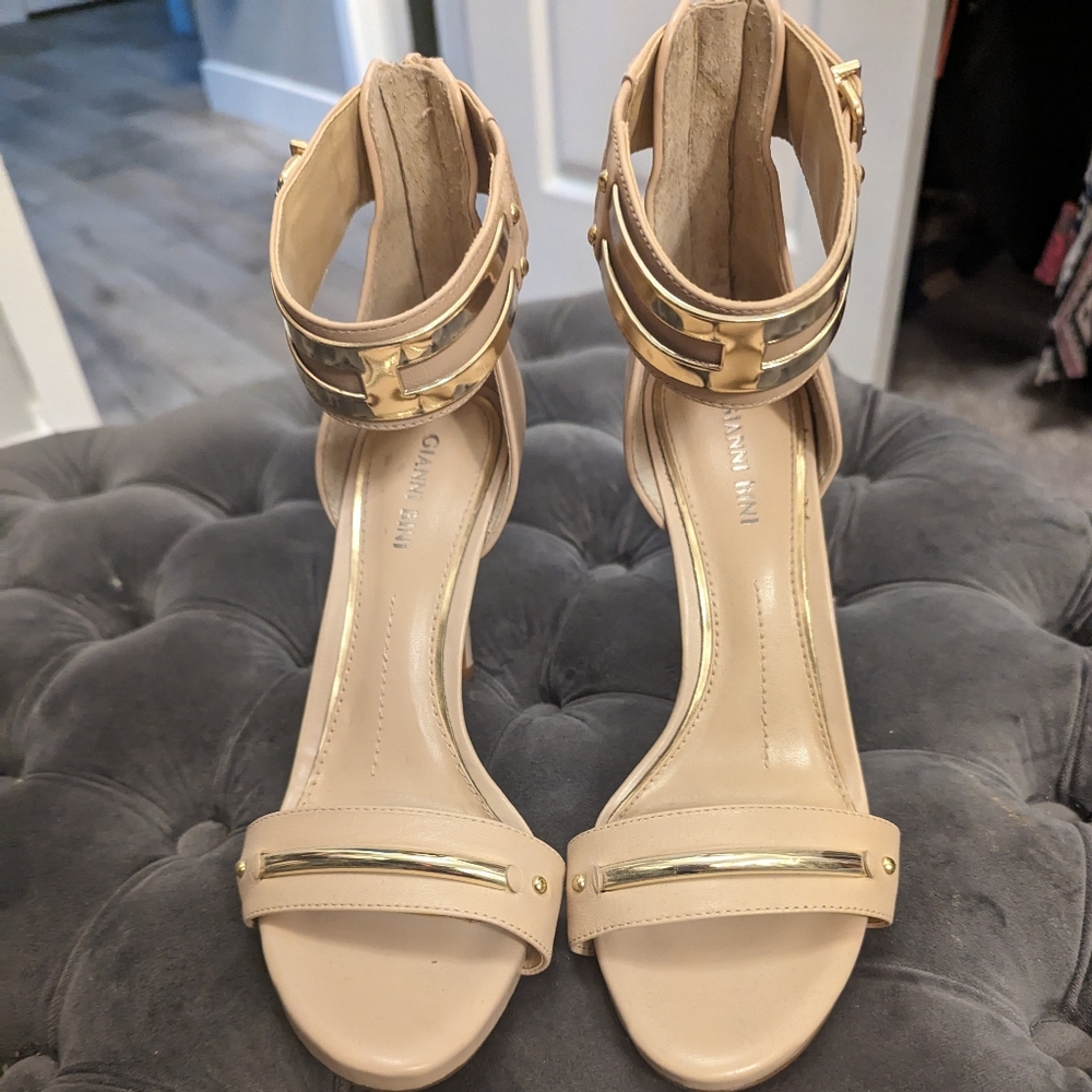 Neutral color stilletos with gold accents and ankle straps
